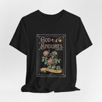 Front view of the black God Endures tee with rose artwork, ornate lettering and a gold banner.